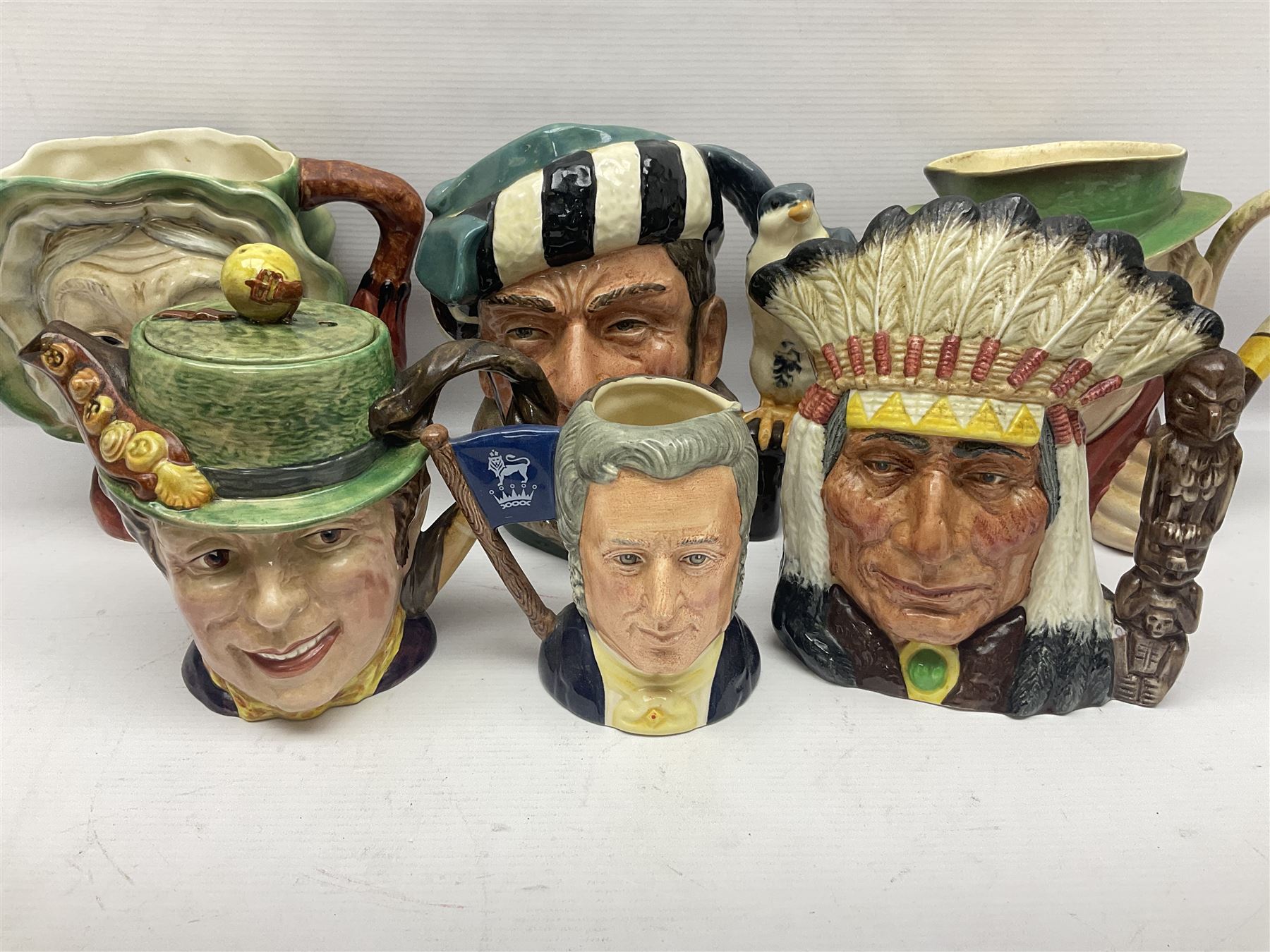 Collection of Royal Doulton and Beswick character jugs of various sizes, including North American Indian D6611, The Falconer D6533,  Tony Weller 281, Sairey Gamp 371 etc