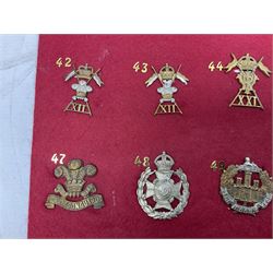 Thirty-two cap badges including Parachute Regiment, Grenadier Guards, East and West Yorkshire, Australian Commonwealth, 3rd Dragoon Guards, various Lancers, Brecknockshire, RFC, RAF, Lancashire Fusiliers, Kings Royal Rifle Corps, Inniskilling etc; mounted on two boards for display (2)