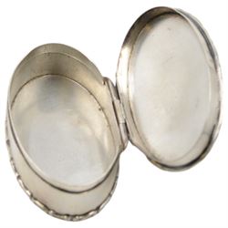 Edwardian silver trinket box, of oval form with embossed scroll rim, the hinged cover inset with a jasperware roundel depicting a classical scene, hallmarked Cohen & Charles, Chester 1905, H2.5cm, W7.5cm