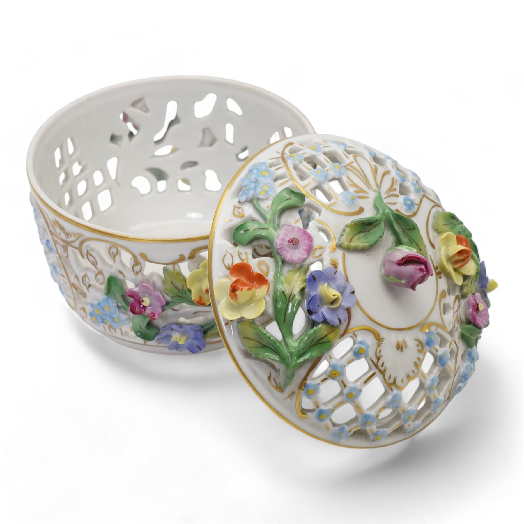 Early 20th century French porcelain tray, hand painted with dancing cherubs, within a pink and gilt border, inscribed 476 beneath, L25.5cm, pair of continental cherub figures, with blue anchor marks beneath, together with a Dresden porcelain pot pourri and cover, with pierced and floral decoration (4)