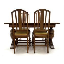 Early to mid 20th century oak dining table, rectangular top with scrolled acanthus leaf and flower head carved skirt, gadroon and acanthus carved twin baluster supports, on sledge feet (143cm x 73cm, H75cm), and set for oak dining chairs with carved back splats