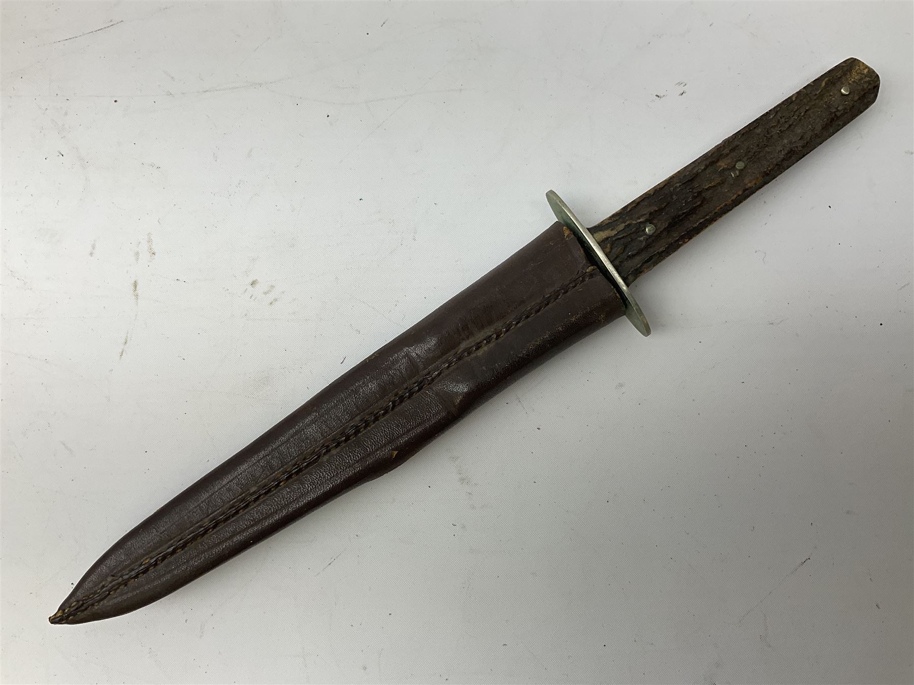 Hunting knife by J Nowill & Sons, Sheffield, the handle inset with mother of pearl, blade length 19cm; George Wolstenholme IXL lock-knife with antler scales L29cm open; and another Bowie style hunting knife marked 'V.R. Warranted Sheffield Joseph Ellis & Sons' in leather sheath (3)