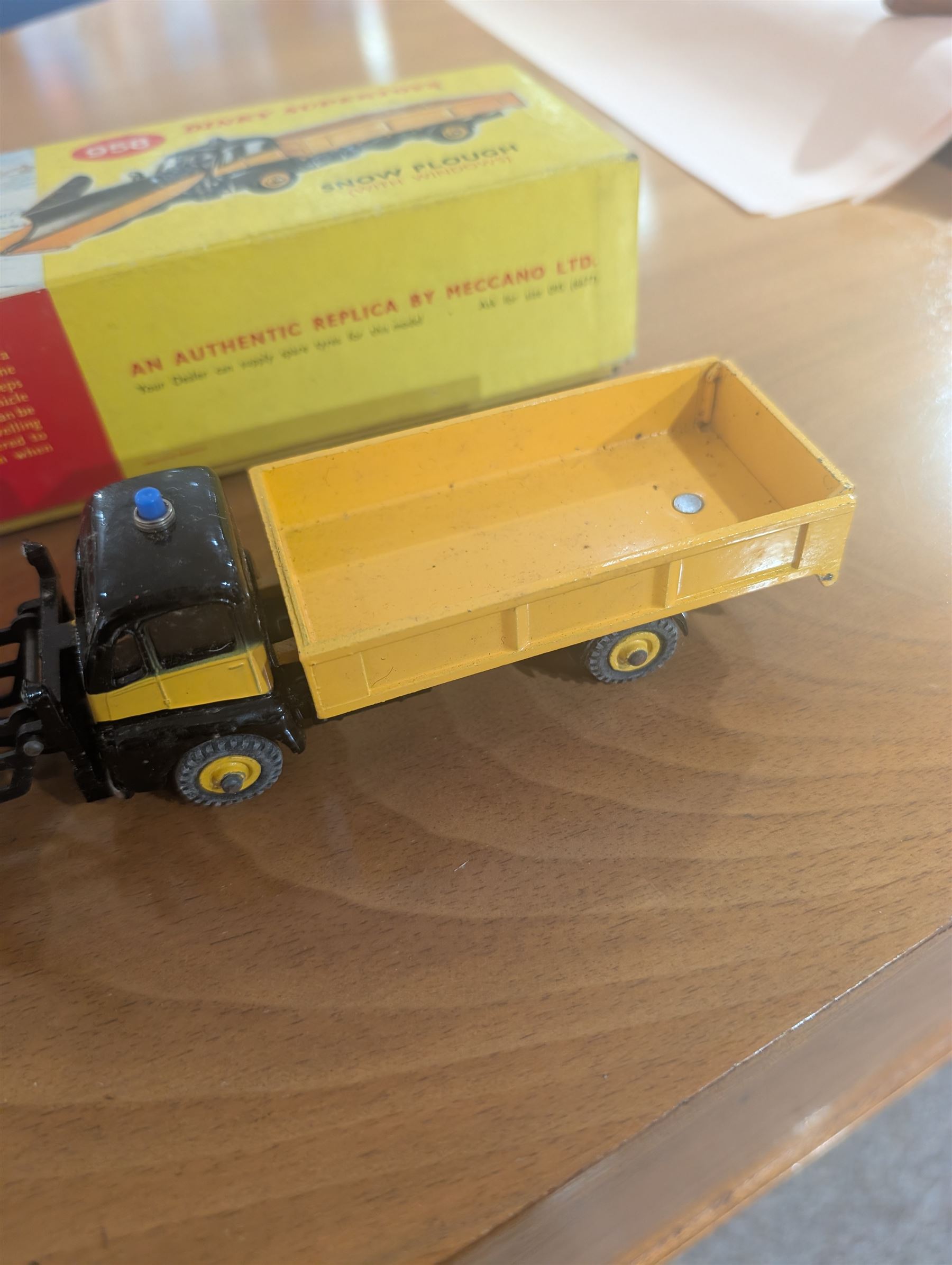 Three Dinky Toys diecast vehicles, comprising Field Marshall Tractor no. 301, Shell BP Fuel Tanker no. 944 and Snow Plough no. 958, all boxed