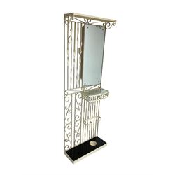 Cream painted scroll work wrought metal hall stand, fitted with mirror, shelf and stick stand