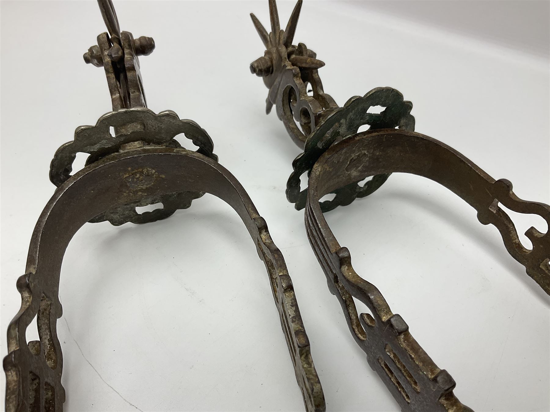 Pair of South American gaucho steel and brass spurs with eight-spike heel rowels, possibly Chilean L25cm