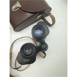 Four pairs of binoculars, to include Carl Zeiss Jena Jenoptem 8x30W serial no. 3750814, Nikon Sporting II 8x40 serial no. 604672, Minolta Pocket II 8x22 Field 7 and Jessops 12x25 Field 4.8 84m/1000m, all in carrying cases 