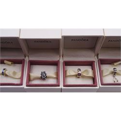Silver Pandora bracelet with heart clasp and four silver Pandora charms, all stamped 925 ALE and boxed
