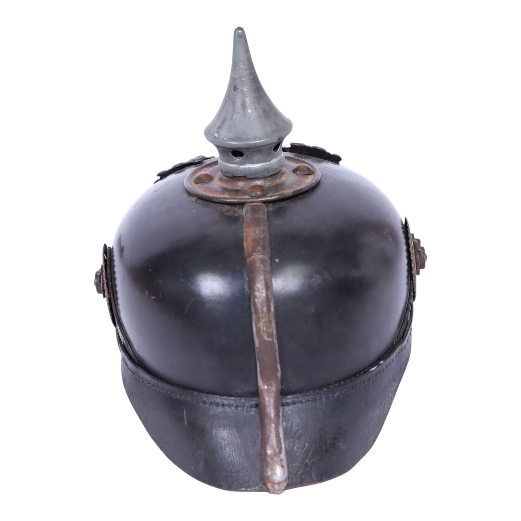WWI Prussian M1915 Pickelhaube, the black leather skull with removable steel spike finial, steel eagle helmet plate and leather chin strap, one side with a black cockade, the other black and red