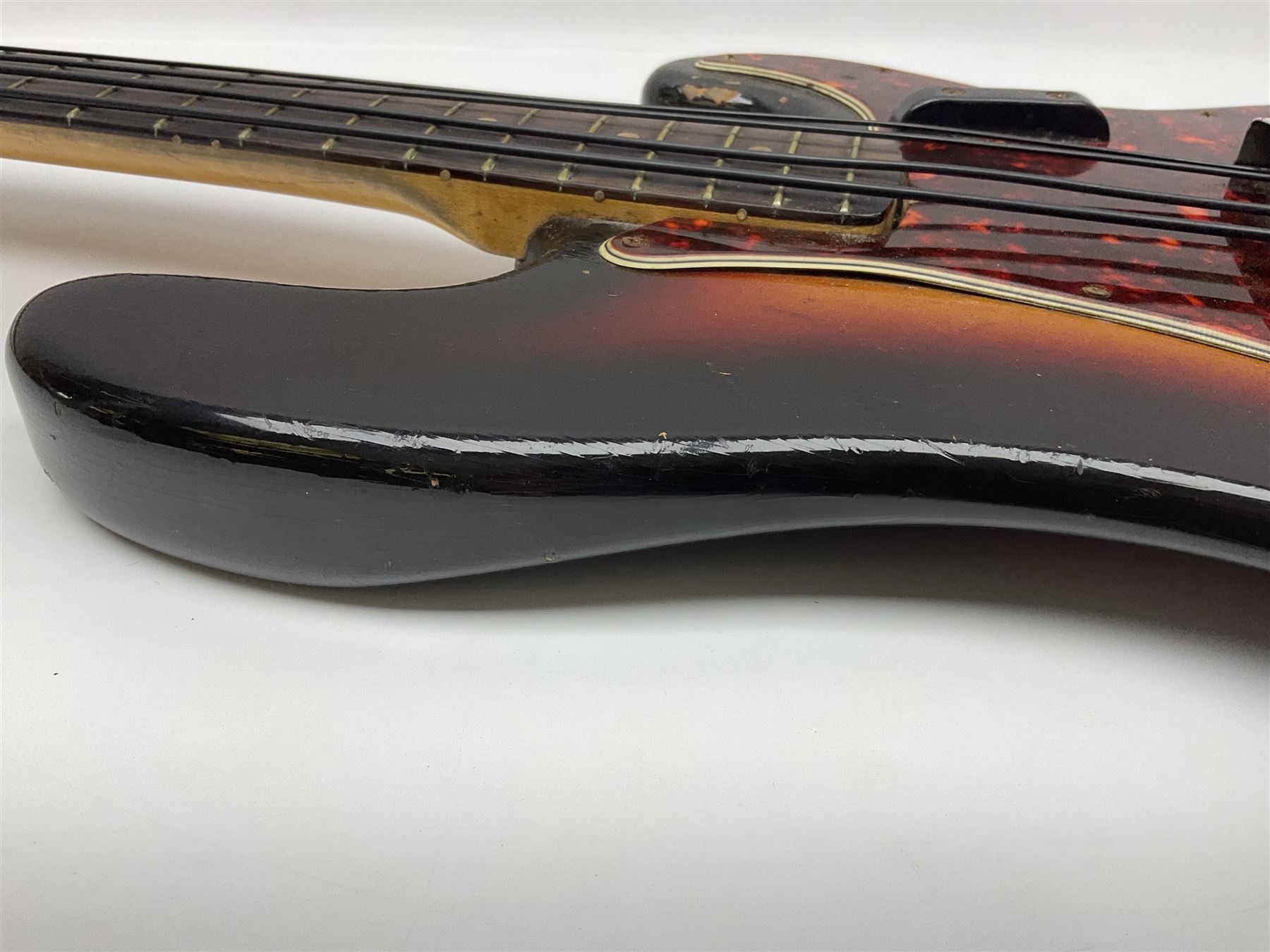 Early 1960s American Fender Precision electric bass guitar with original three-tone sunburst finish and faux tortoiseshell scratch plate; rosewood fretboard; all original fittings including chromium plated bridge and pick-up covers, finger rest, 'pots' and machines, dated on end of neck 5NOV62C, serial no.91625; L115cm overall; in Selmer simulated reptile skin covered carrying case. Sold with non-transferrable CITES A10 licence, certificate no.23GBA10CNKKEB, serial no.441200, dated 30th August 2023. Also included are original 1960s photographs of the band 'The Rascals' and photocopies of newspaper cuttings advertising their forthcoming performances along with a photocopy of a photograph of their television appearance on 'Opportunity Knocks' in 1967/8 (coming second to Mary Hopkins). In addition there is a reel-to-reel tape recording and USB stick of the band playing and two sheets of biographical information. Auctioneer's Note: The guitar was ordered by Trevor Parker from Pat Cornell's Music Shop, Spring Bank, Hull and imported from the USA in 1962, well before it was available in the UK. Trevor was the bass guitarist of The Rascals from Hull, later The Ides of March, who supported artists such as Elton John on the Hull circuit. Trevor played the guitar extensively until 1969 when The Rascals disbanded, he got married to Maureen and settled down to family life. Trevor sadly passed away in 2017, and after being in store for fifty-four years his widow has decided it is time for his guitar to be sold.