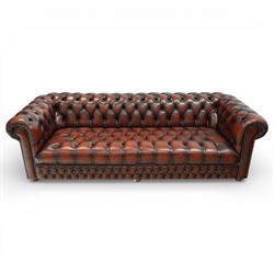 Late 20th century four seat Chesterfield sofa, upholstered in deep buttoned maroon leather...