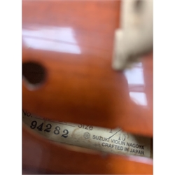 Three modern graduated violins - Suzuki 1/10 size child's violin with 23.5cm single piece back, bears label serial no.94282, 40cm overall; copy of Antonius Sradivarius of Cremona violin dated 1998 with 28cm two-piece back, 47cm overall; and Strobel violin with 35.5cm two-piece back, bears label dated 2006, serial no.512801325, 59cm overall. All cased with bows (3)