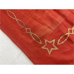 1970s Soviet banner printed in gold on a red ground, roughly translates as 'Transferable Banner - To the winner in the Socialist Competition' and 'Work Study Live by Communism' verso; wreath of wheat ears to either side; tassels on three sides 110 x 155cm
