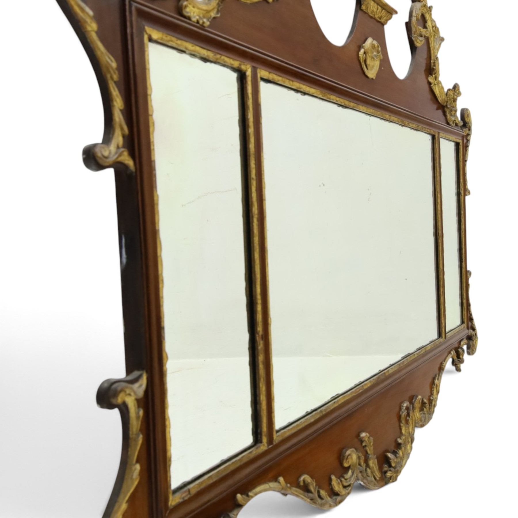 George III Chippendale design mahogany and parcel-gilt tripartite fret mirror with Hoho bird pediment