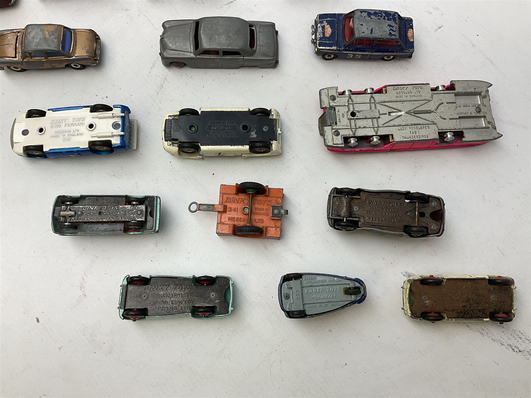 Dinky - twenty-five unboxed and playworn die-cast models including Lady Penelope FAB1, Caravan, Ford Sedan, Triumph TR2, Packard, Austin Somerset, Devon, Healey and Seven Countryman etc (25)