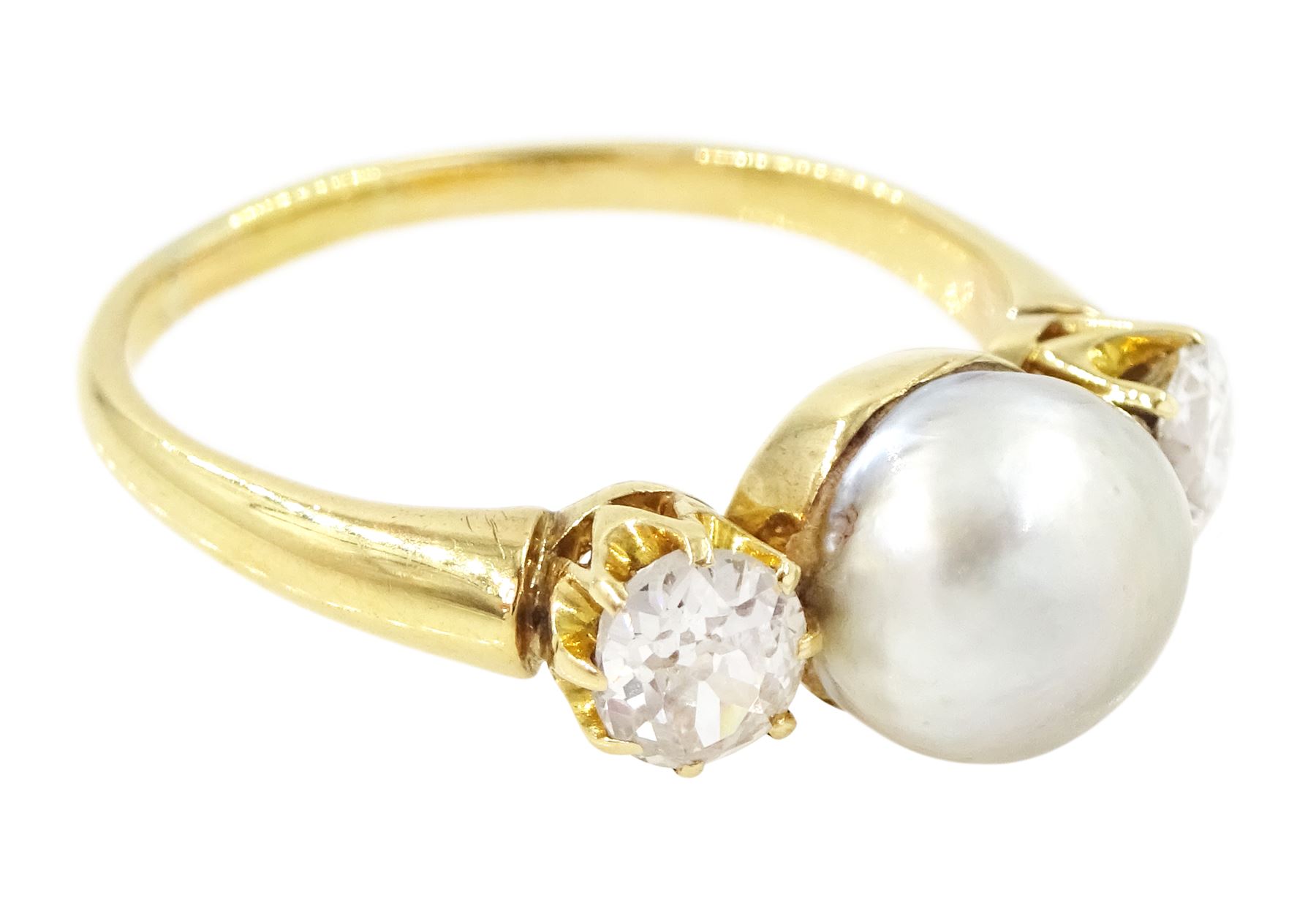 Early 20th century 15ct gold pearl and diamond three stone ring, single grey pearl with an old cut diamond set either side, total diamond weight approx 0.55 carat