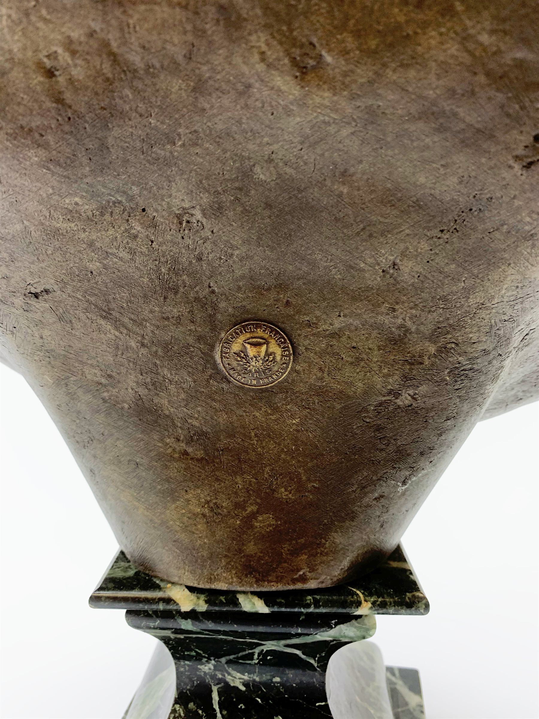 After R. Nannini, large bronzed spelter head and shoulder bust of Napoleon wearing a laurel wreath, on variegated green marble base with gilt metal 'N' and eagle, bears signature and Paris France fabrication medallion H54cm