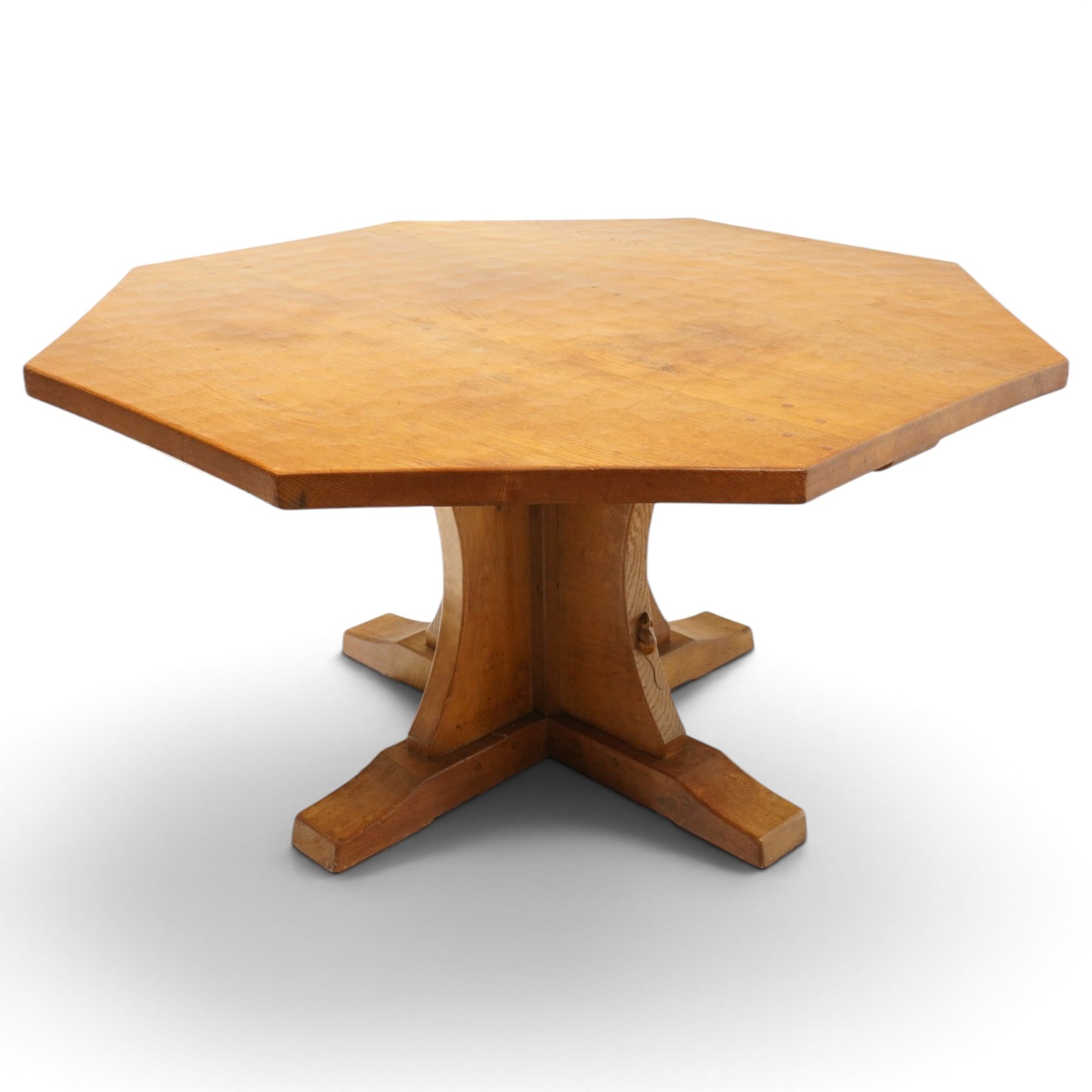 Mouseman - 1940s pre-war adzed oak octagonal dining table, the octagonal adzed top with concave sides, raised on a cruciform base with sledge feet, with carved mouse signature, by the workshop of Robert Thompson of Kilburn

Provenance: ordered directly from the Mouseman workshop in the 1940s before the outbreak of the war, the items were subsequently delivered after the end of war. 