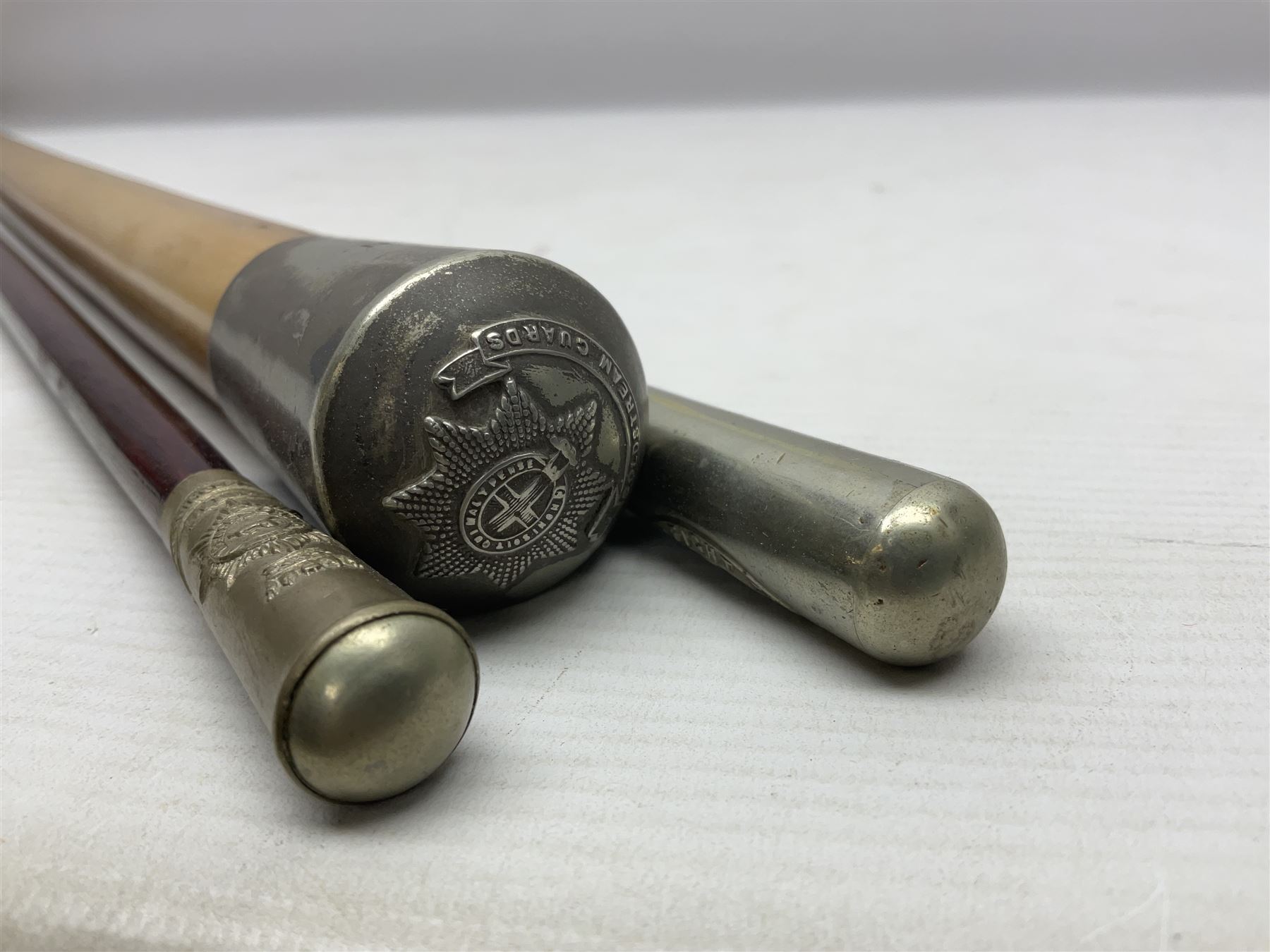 Three parade ground canes - malacca cane Coldstream Guards with plated mount engraved 'H.A. Myhan' L87cm; ebonised Church Lads Brigade 'Fight The Good Fight'; and mahogany stained Worcestershire Regiment (3)
