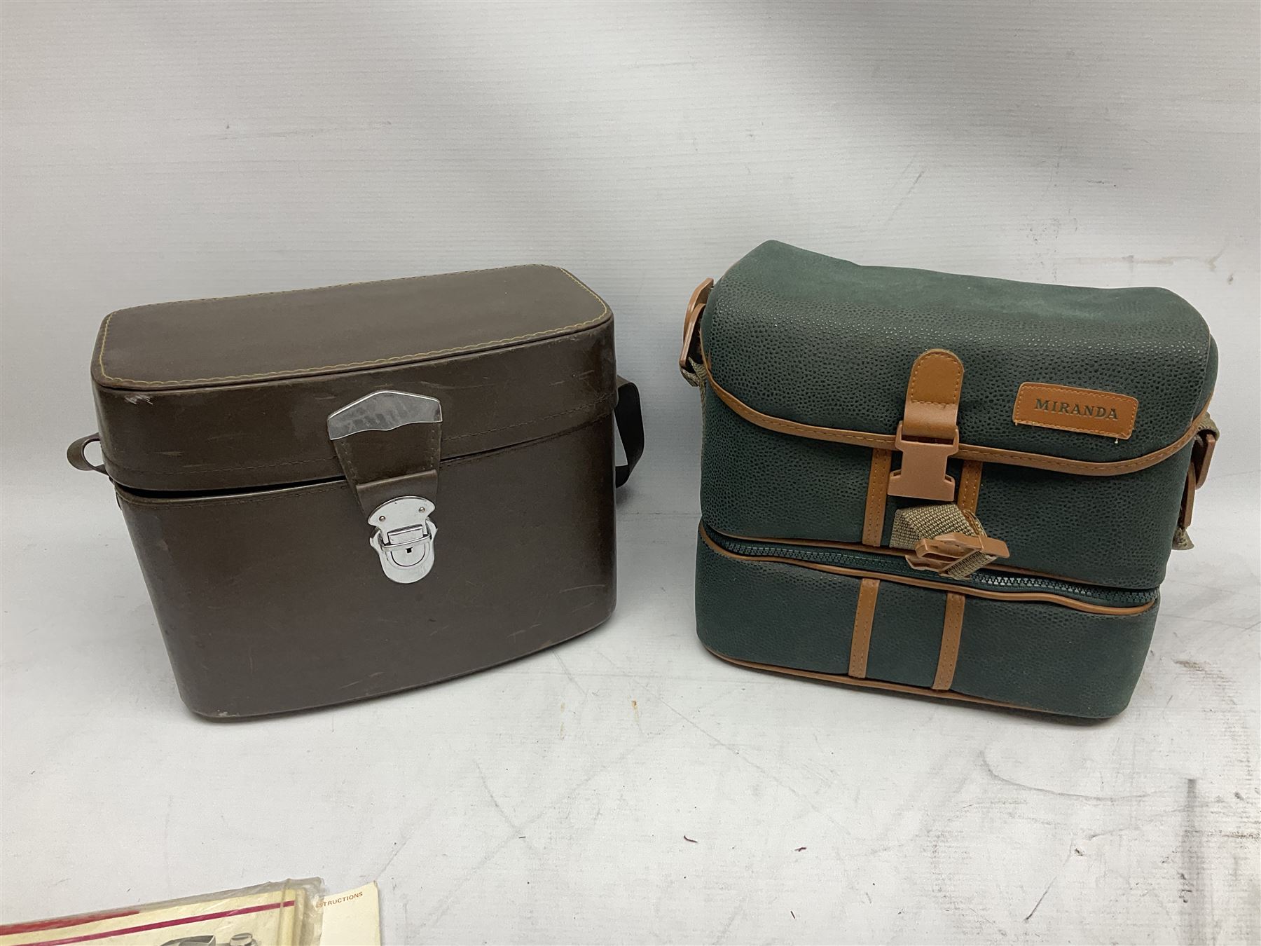 Miranda Sensorex camera body, Miranda Sensorex II camera body with 'Auto Miranda 1:1.8 f-59mm' lens, 'Auto Miranda 1:2.8 f-135mm' lens, 'Auto Miranda 1:3.5 f-200mm' lens, 'Auto Miranda 1:2.8 f-28mm' len, Agfa plate camera with 9cm x 12cm plates and other camera equipment including Miranda camera bag