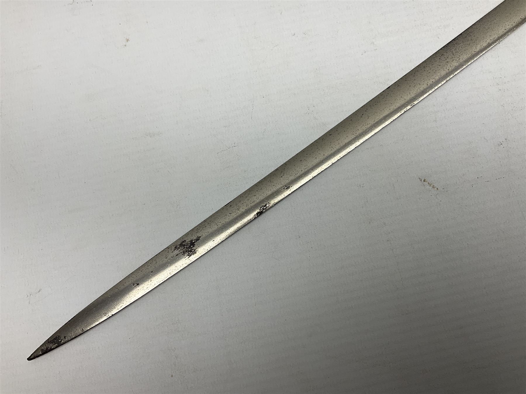 1900-1918 German Imperial NCO sabre with WW2 modifications of Wehrmacht insignia to the langet, 79cm slightly curving fullered blade and brass hilt, the knucklebow chased with oak leaves and acorns L90.5cm overall
This item has been registered for sale under Section 10 of the APHA Ivory Act 