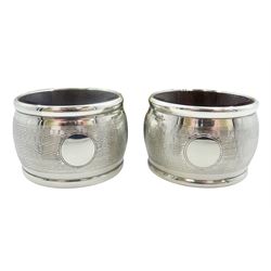 Pair of 1930's silver mounted Bakelite napkin rings, with engine turned decoration and vacant circular panel, hallmarked Joseph Gloster Ltd, Birmingham 1931, contained within a fitted case, together with a 1930's set of six silver handled tea knives with scimitar blades, hallmarked Walker & Hall, Sheffield 1933, contained within a fitted case, and a mid 20th century set of six silver thistle top coffee spoons, hallmarked Robert Allison, Glasgow 1957 and 1959, contained within a fitted case, approximate gross silver weight 8.42 ozt (262 grams)