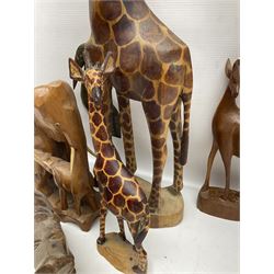 Collection of carved wooden animals, including leopard, elephants, camel etc