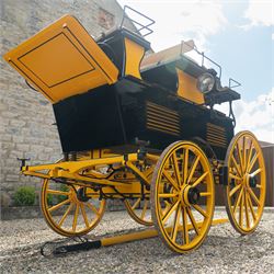 Roof Seat Break by Shanks of London

A roof seat break by Shanks of London built on a perch in black and yellow livery, the body fitted with an elevated driver's box seat, elevated rear groom's seat and central passenger compartment. The carriage is mounted on wooden spoked wheels with leaf spring suspension and is equipped with louvred underbody storage compartments, carriage lamp brackets (lamps next lot), folding access steps and a pole for driving with a pair or team of horses. The wheel hubs are stamped 