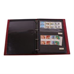 Queen Elizabeth II mint decimal stamps in four folders, face value of usable postage approximately 650 GBP