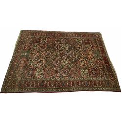 Persian red ground carpet, central field set with square nature motifs
