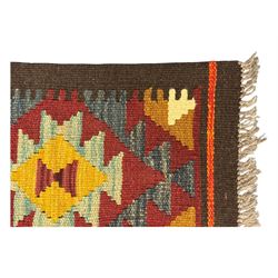 Maimana Kilim ground runner, multicoloured geometric medallions arranged in rows, with triangular motifs in the field, the wide border in brown with contrasting guard bands