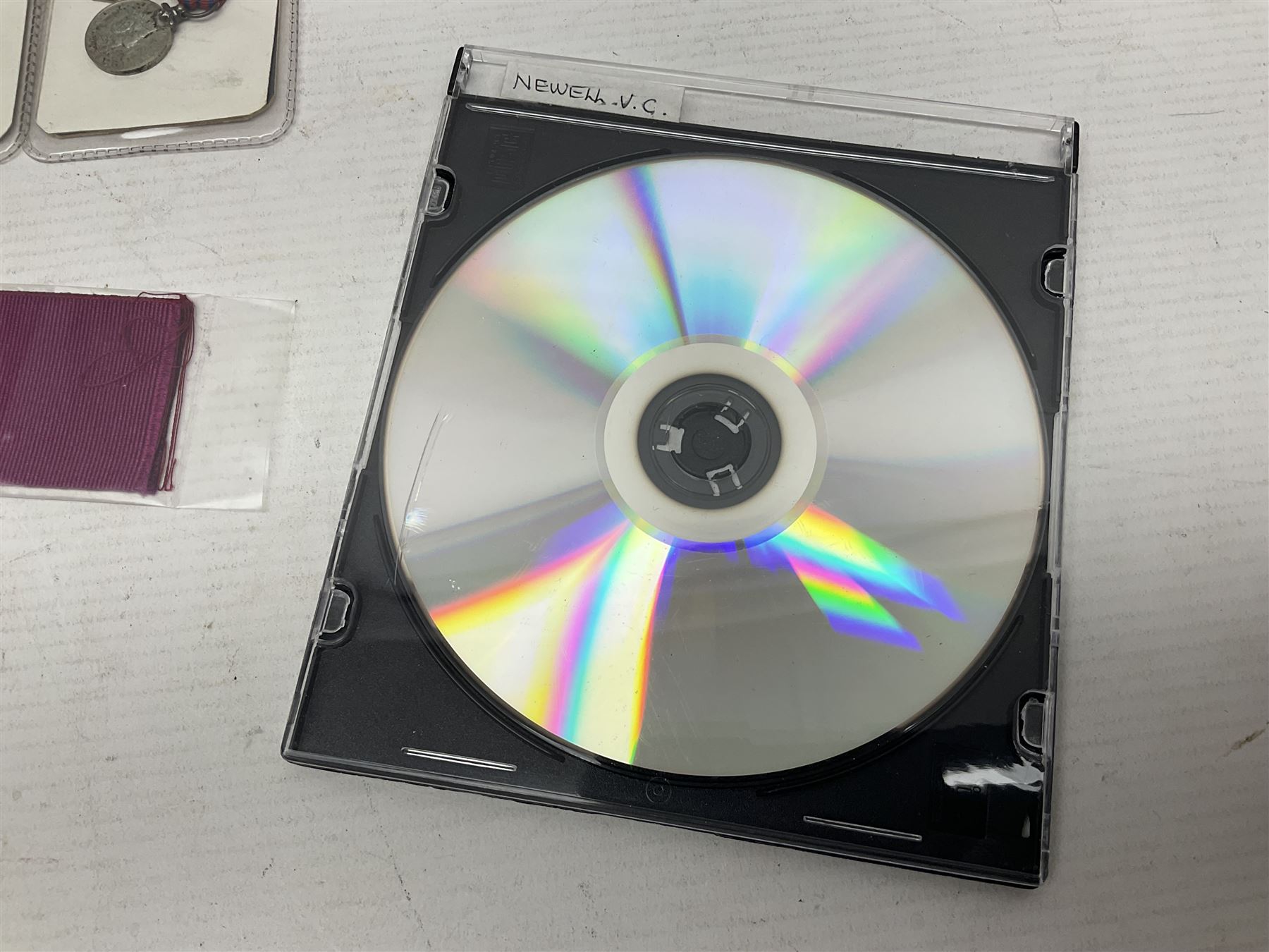 Two Imperial Service Medals to Elsie Hannah Ferguson and Fred Whitehead; each in original case; WWI Special Constabulary Medal to Inspr. Alfred W. Thompson; modern Prisoner of War Medal; cased; replica Victoria Cross and India Mutiny Medals with archive of information relating to Pte. Robert Newell V.C. 9th Lancers; replica Victoria Cross and George Cross with miniatures; and other replica medals etc