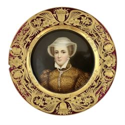 Set of three late 19th century Vienna cabinet plates, each finely painted with a quarter length portrait depicting a female beauty to include Louise of Mecklenburg-Strelitz and Mary Queen of Scots, all within burnished gilt urn and floral borders on alternating brown and red ground, all signed Wagner and with underglazed blue beehive and impressed marks and entitled Königin Louise, La Pensée and Marie Stuart beneath, D24cm