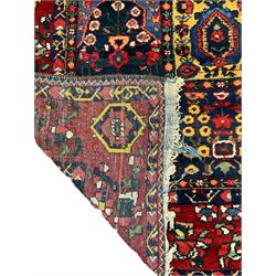 Large Persian garden rug, multiple rectangular panels decorated with stylised plants, Boteh and tree of life motifs, the outer guarded border with floral design 