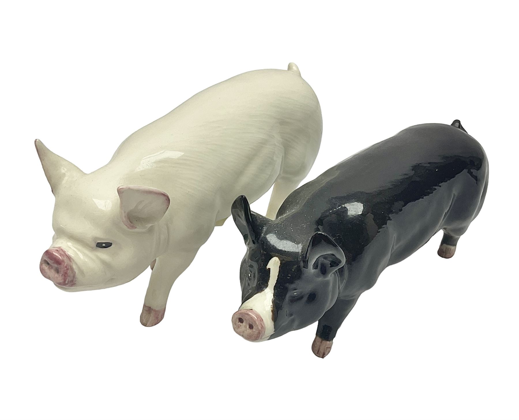 Two beswick rare breed pigs, comprising Middlewhite Boar No 4117 and Berkshire Boar No 4118, with printed marks beneath 