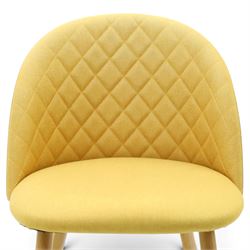 Set of four contemporary yellow upholstered dining chairs, with wrap around back with quilted stitching, padded seat raised on light oak tapering supports 