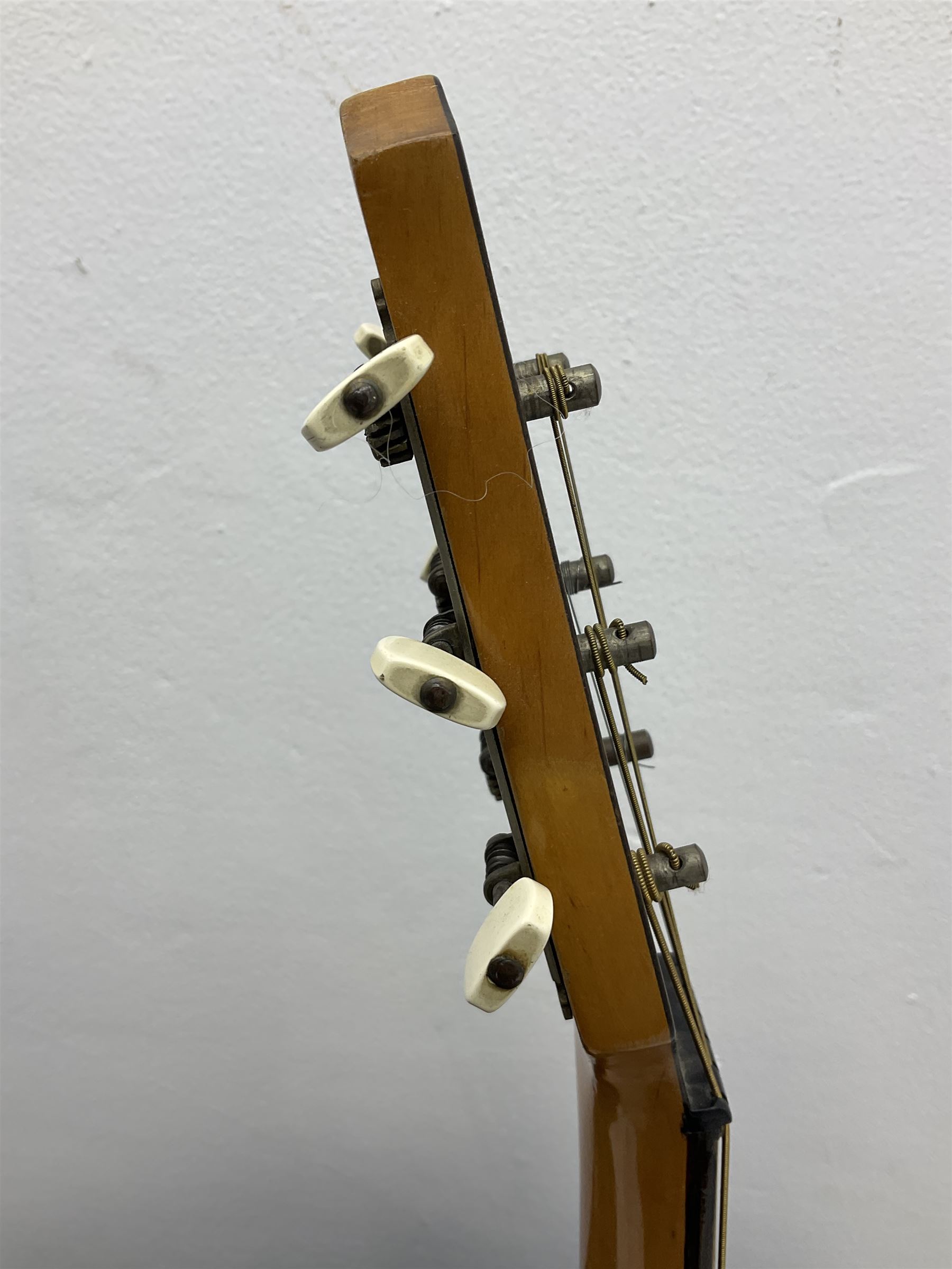 1950s acoustic guitar with f-holes and pickguard L105cm; black fur lined hard carrying case