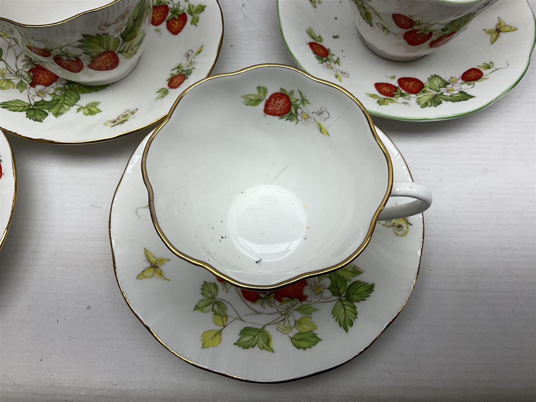 Ringtons and Queen's China Virginia Strawberry pattern teawares, including teacups, saucers, milk jugs, sugar bowls, etc