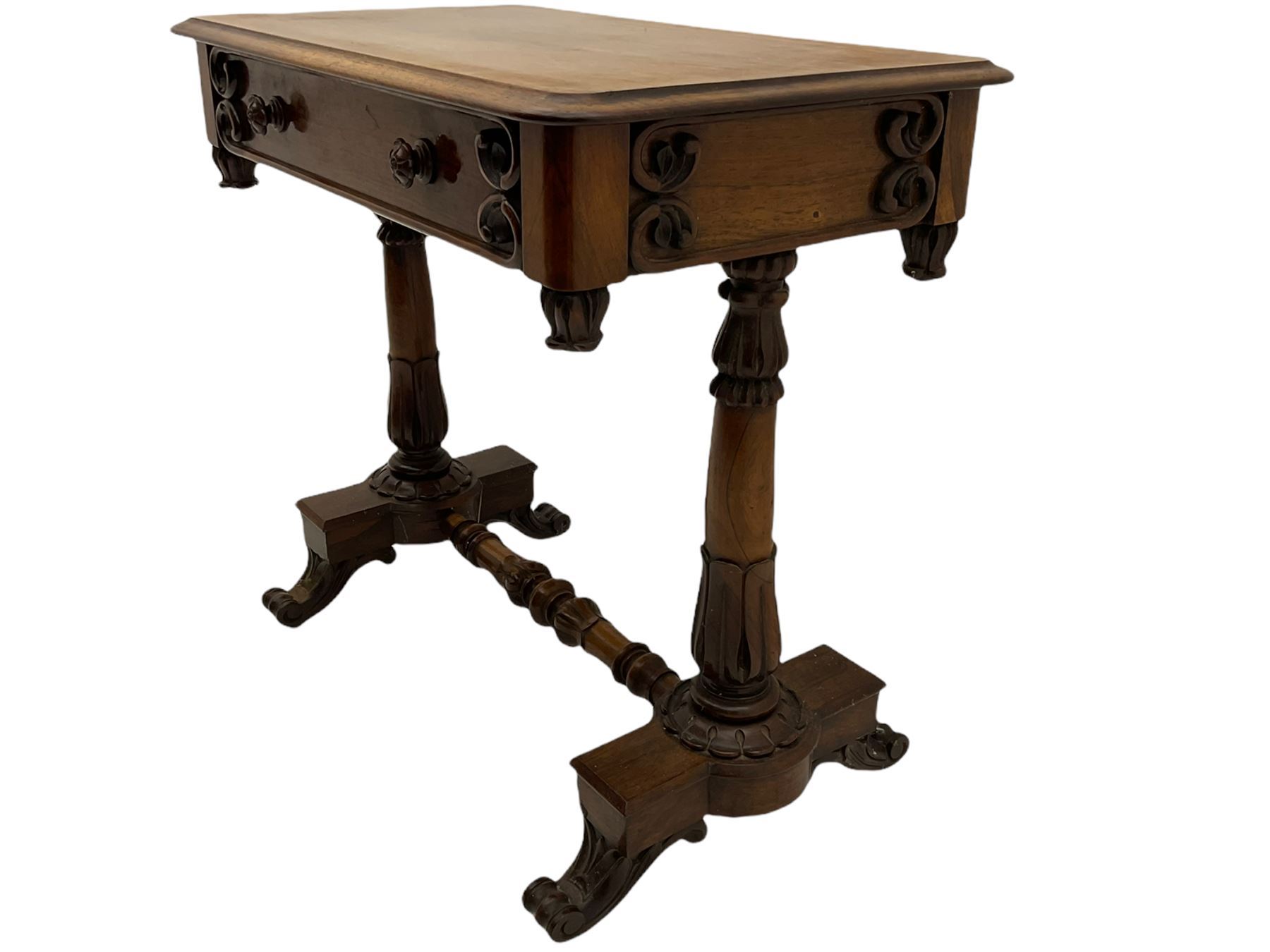 Victorian rosewood stretcher table, moulded rectangular top with rounded corners over single drawer, turned and carved twin pillar supports on platforms joined by turned stretcher, scroll carved feet