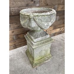 Cast stone centerpiece urn on plinth