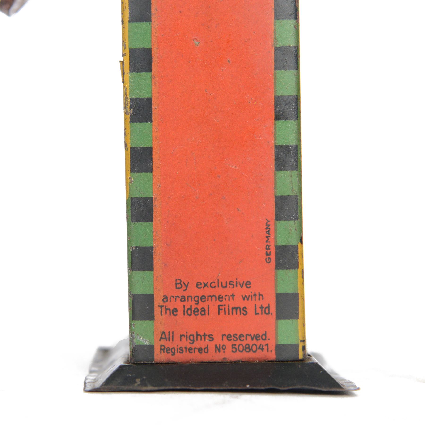 1930s Saalheimer & Strauss Mickey Mouse 'Smile Please' mechanical tin plate money box, depicting Mickey Mouse posing with folded hands to the front and verso as a photographer, above the motto 'If you only pull my ear you will see my tongue appear. Place a coin upon my tongue save your money while you're young', marked to one side 'By exclusive arrangement with Ideal Films Ltd. All rights reserved. Registered No 508041', with key, H17cm

