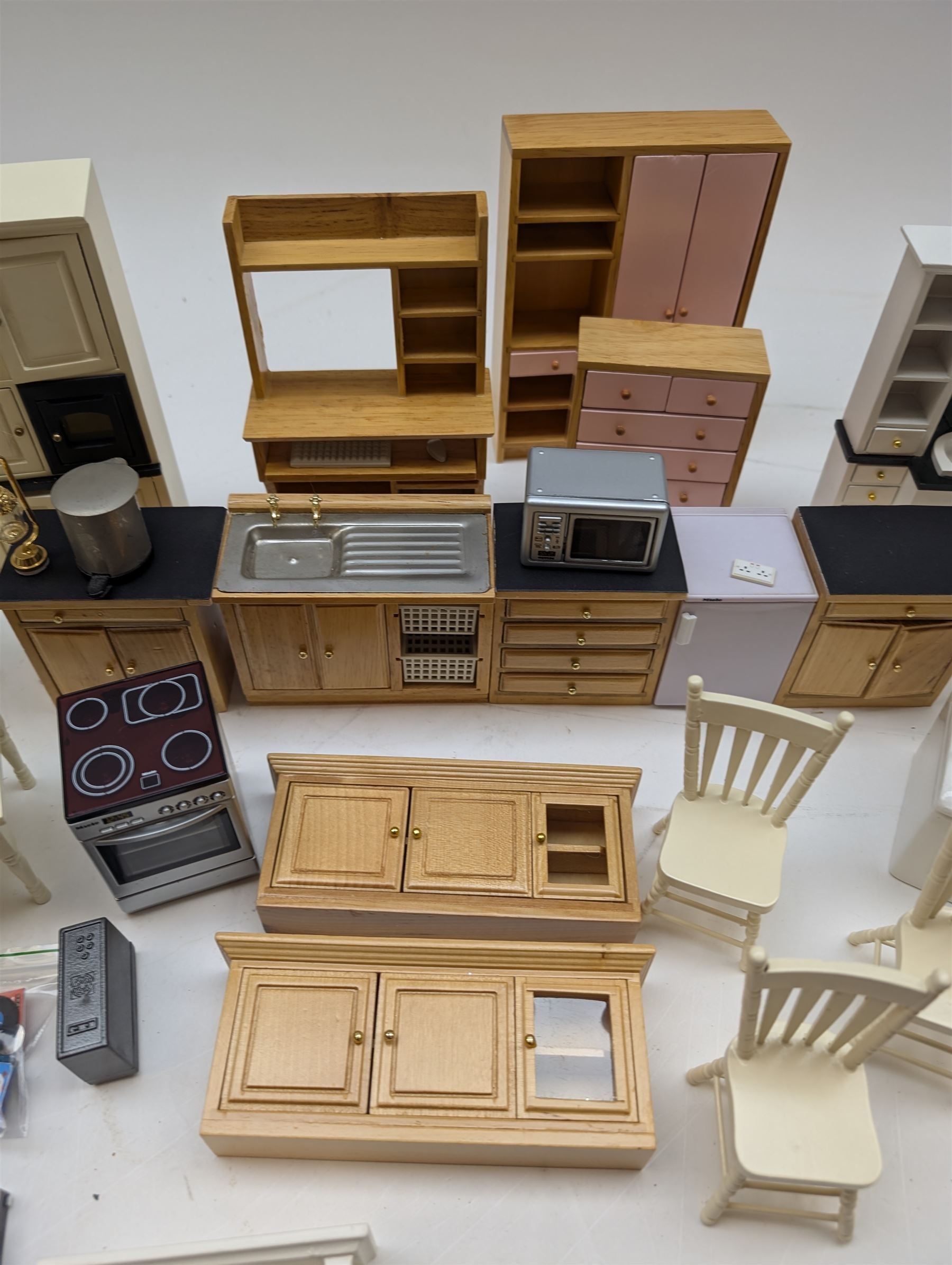Modern 1:12 scale dolls house furniture, comprising pine kitchen set, with wall cabinets, floor cabinets and sink unit, white wooden bathroom suite, white wooden kitchen and dining room furniture and appliances, wooden bedroom furniture, Raine purple wingback chair, tv, desk, fish tank, etc