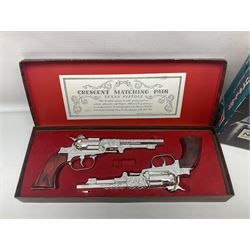 Crescent, Cap Guns - boxed 'Crescent Matching Pair' of 'Texan Pistols' toy cap guns; containing two ''Rustler Texan' ornately decorated pistols finished in silver / plated effect with brown marbled moulded grips; and Japanese Gakken Electronic Project Kit; boxed with wooden base and instruction booklet (2)