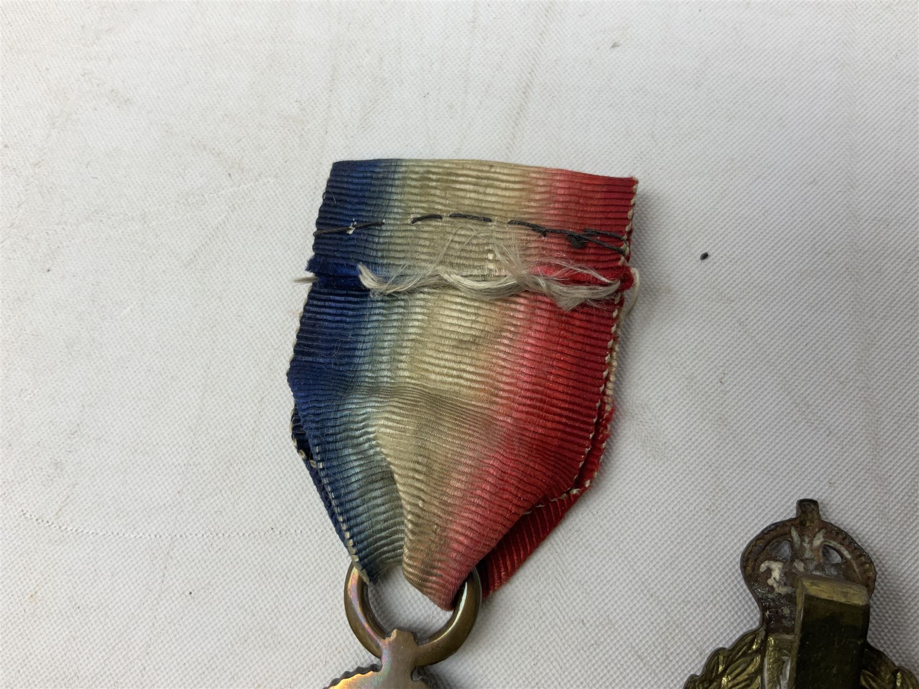 Three WW1 medals comprising 1914-15 Star awarded to 58648 Spr. C. Roberts R.E.; British War Medal and Victory Medal awarded to 87502 1.A.M. C. Roberts R.F.C.; and REME cap badge (4)