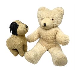 Mid-20th century English plush covered woodwool filled dog with vertically stitched nose and mouth L39cm; and Wendy Boston plush covered teddy bear, the fixed head with applied eyes and vertically stitched nose and mouth H63cm (2)