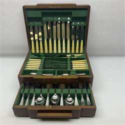 Art Deco canteen of silver plated cutlery for twelve place settings, including table and dessert knives with ivorine handles, retailed by Harrods Ltd, contained within a wooden case, with drawer to base, canteen case H15.5cm