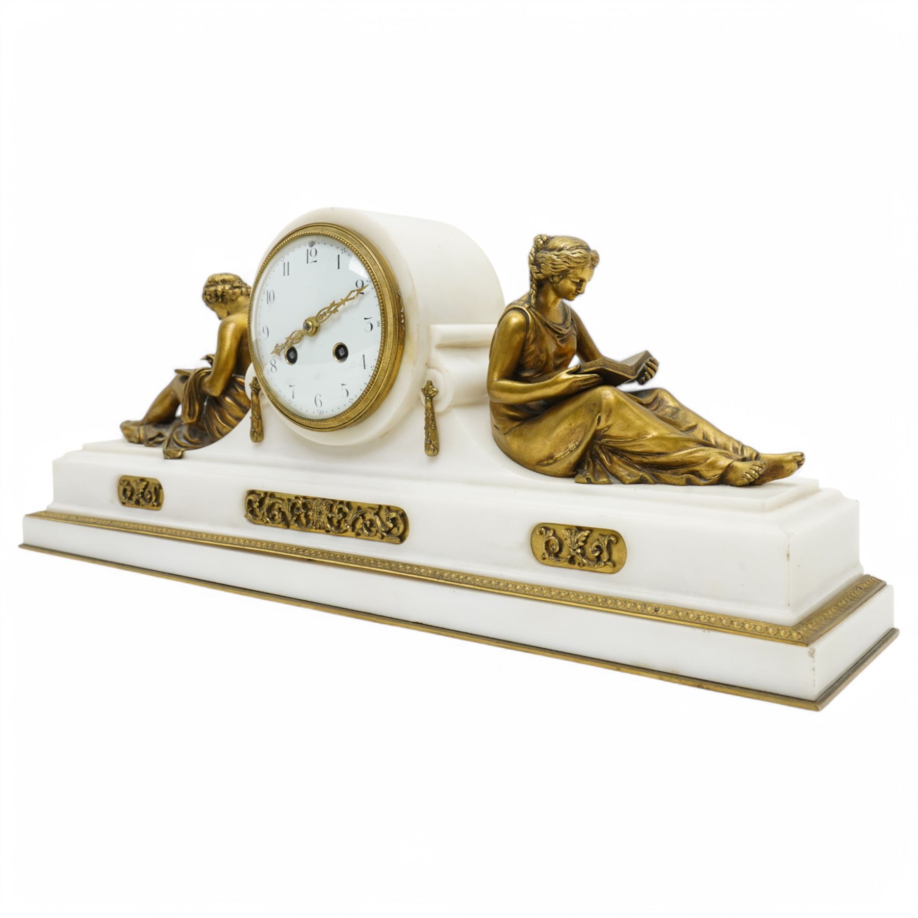 French- Fine early 20th century 8-day white marble mantle clock, on a rectangular stepped plinth with recessed brass banding and inset oval brass panels with raised scroll and leaf decoration, drum cased Parisian  movement flanked by a pair of seated cast brass figures taken from classical antiquity, with a convex white enamel dial and glazed cast brass bezel, Arabic numerals and minute markers with matching pierced brass hands, twin train going barrel movement with a recoil anchor escapement and rack striking, sounding the hours and half hours on a bell. With pendulum.  