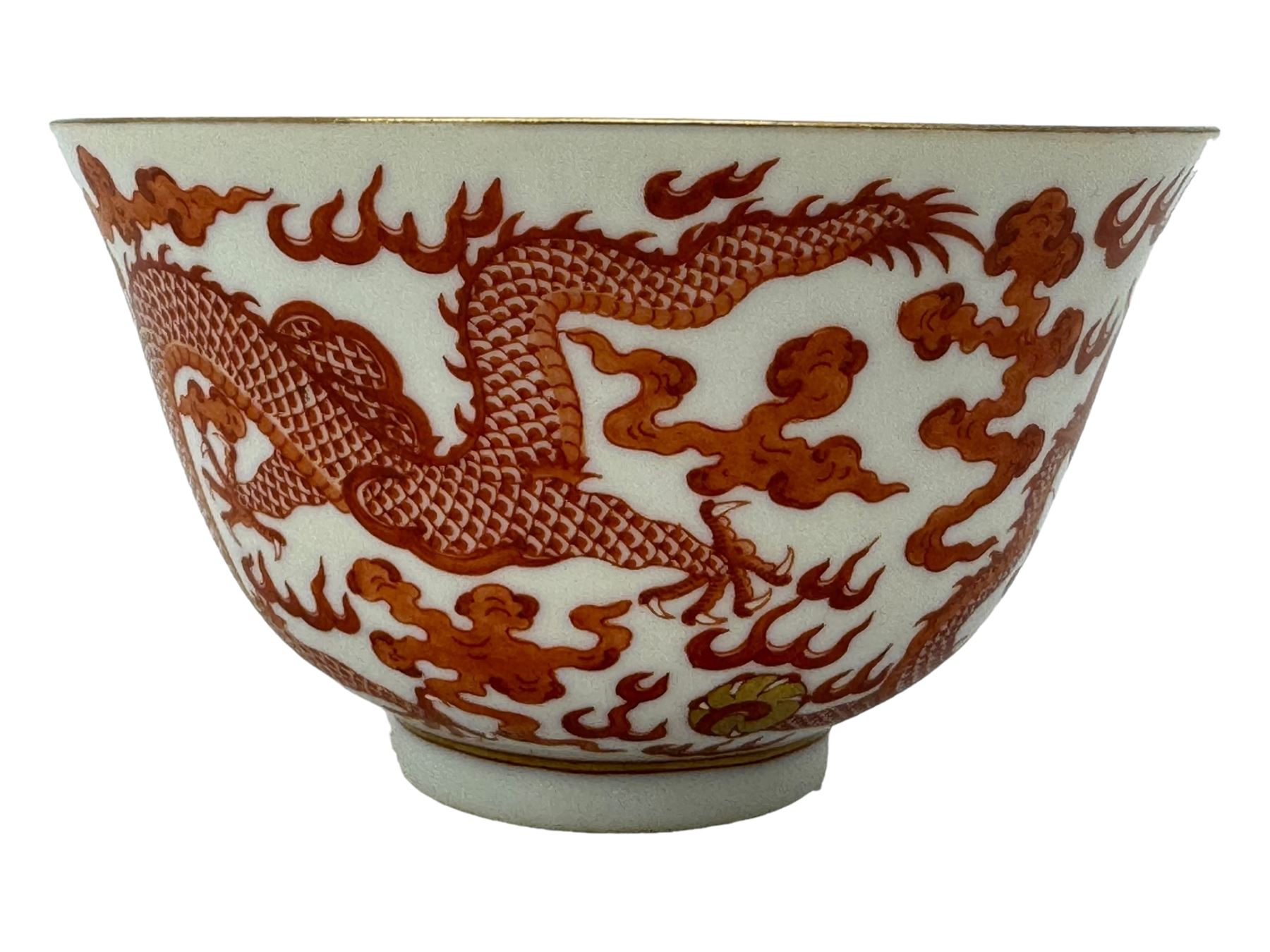 Chinese porcelain iron red tea bowl, the exterior painted with two five claw dragons chasing the flaming pearl, amidst clouds, red Quinlong seal mark beneath, D10.5cm x H6.5cm