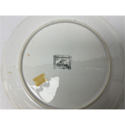 Three Fornasetti plates from the Melodramma series, each depicting a operatic portraits within a border of operatic emblems on gilt ground, with printed mark beneath, D25cm 