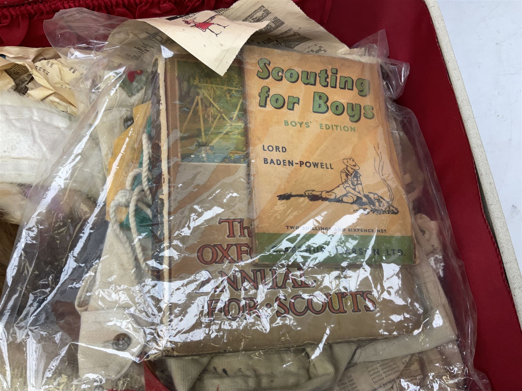 Scout uniform and scout books, together with a vintage suitcase, and mink stoles 