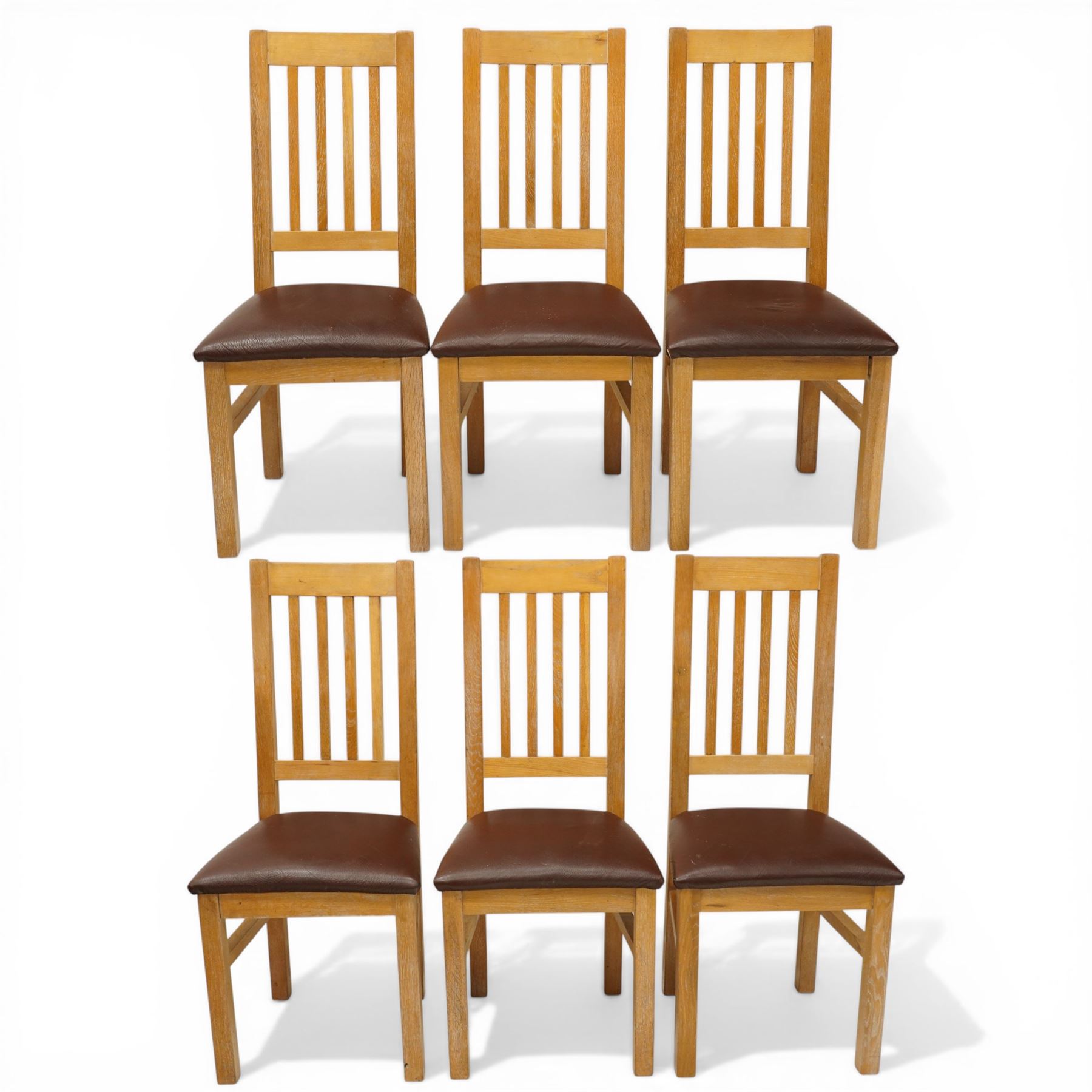 Late 20th century solid light oak refectory style dining table, rectangular top raised on square supports united by stretcher (W180cm D100cm H81cm); Set of six light oak high-back dining chairs with burgundy leather seats (W49cm H109cm)